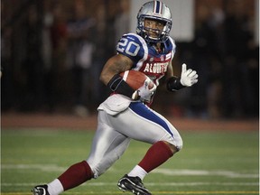 Alouettes running-back Tyrell Sutton carries the ball during game against the Ottawa Red Blacks at Montreal's Molson Stadium on Aug. 29, 2014.