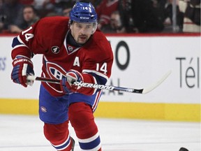 The Canadiens' Tomas Plekanec shoots the puck into Florida Panthers  zone during  NHL game in Montreal on Feb. 19, 2015.