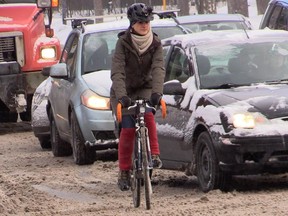 Winter cycling in Montreal needs improvement, according to the Copenhagenize Index. Above: Magali Bebronne, Vélo Quebec spokesperson for winter cycling, demonstrates how to dress appropriately for winter cycling.