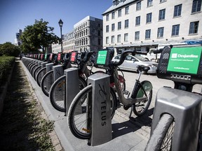 Bixi bicycles line up at a station on de la Commune street in Old Port in Montreal on Thursday, July 12, 2012.