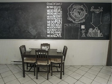 A wall-sized chalkboard in the kitchen of Ali Benryane's apartment in Little Burgundy.  Guests to his frequent parties leave messages on the board.