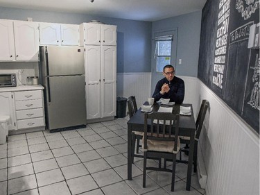 Ali Benryane has coffee in the kitchen his apartment.