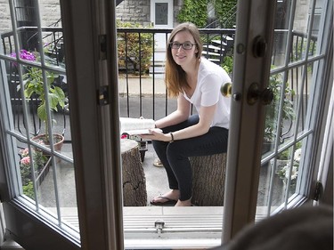 Hayley Kezber on the front balcony of her apartment, which she shares with her brother in Montreal.