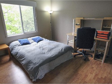 The guest bedroom with an office area in Ali Benryane's apartment.