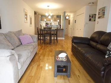 Another view of the living room with dining room and kitchen in the background.