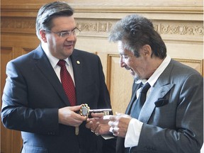 International movie star Al Pacino, right, receives the key to the city by Montreal mayor Denis Coderre on Sunday June 7, 2015 at city hall. Pacino was at city hall to sign the book and receive the key to the city.