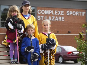 Marie Rennie with her children Gracie, Braden and Adeline at the St-Lazare Sports Complex in St-Lazare on Sunday, June 7, 2015.  St-Lazare's new sports funding formula will mean higher costs to participate in ice sports.