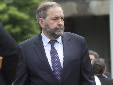 Federal NDP leader Thomas Mulcair arrives for the state funeral of fomer Quebec Premier Jacques Parizeau held in Montreal on Tuesday June 09, 2015.