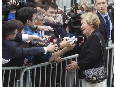 Former Quebec Premier Pauline Marois speaks to reporters as she arrives for the state funeral of former Quebec Premier Jacques Parizeau held in Montreal on Tuesday June 09, 2015.