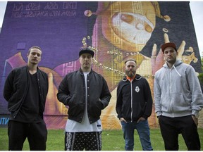 Left to right,  co-founders of the Festival D'Art Publique, Nicolas Munn Rico, Yan Cordeau, André Bathalon and Alexis Froissart on St Laurent Boulevard, in front of a mural by the Chilean artist Inti, in Montreal, on Monday