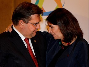 Montreal mayor Denis Coderre speaks with Anne Hidalgo, mayor of Paris, in Montreal June 10, 2015, at the start of the first Living Together Summit.