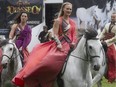 Elise Verdoncq, centre, and other members of the Cavalier Odysséo horse show, participate in promotional event outside Montreal city hall on Thursday, June 11, 2015.
