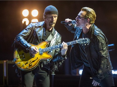 Bono, right, and The Edge, left, of the Irish rock band U2 perform at the Bell Centre as part of their iNNOCENCE + eXPERIENCE Tour in Montreal on Friday, June 12, 2015.