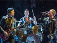 Bono, right, The Edge, left, and Larry Mullen Jr., centre, of the Irish rock band U2 perform at the Bell Centre as part of their iNNOCENCE + eXPERIENCE Tour in Montreal on Friday, June 12, 2015.