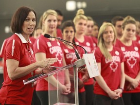 MONTREAL, QUE.: JUNE 12, 2015 -- Three-time Olympic medallist and ambassador for the Canada Olympic Excellence Day, Nathalie Lambert speaks at the formal presentation of the Toronto 2015 Team Canada athletes and Olympians/ Paralympians. The event took place at the Institut National du Sport du Québec on Friday, June12, 2015 in Montreal. The presser promoted the International Olympic Day which will be commemorated worldwide on June 23. Canadian athletes and para-athletes will participate in an Olympic and Pan Am-themed day of events in Montréal and two other cities.(Marie-France Coallier / THE GAZETTE)