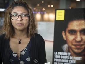 Ensaf Haidar, the wife of imprisoned Saudi blogger Raif Badawi, waits to speak at a press conference in Montreal  on Tuesday at the launch of 1000 coups de fouet, a collection of 14 banned texts by Badawi.