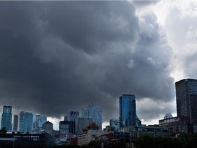 Storm clouds roll in over the skyline of Montreal in this file photo.