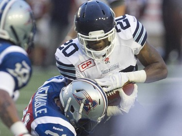 Montreal Alouettes Winston Venable, takes down Toronto Argonauts Henry Josey, during pre-season CFL football action in Montreal on Thursday June 18, 2015.
