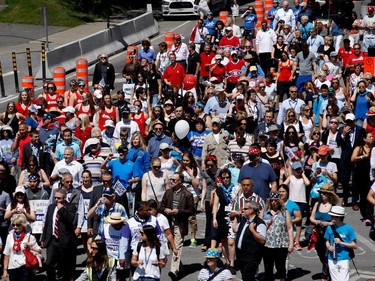 A large crowd fills the corner of Decarie Blvd. and de Maisonneuve as they take part in the Walk for Montreal to inaugurate the new MUHC Glen site in Montreal on Saturday June 20, 2015.