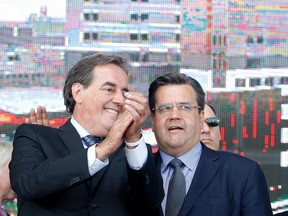 MUHC president and director general Normand Rinfret, left, and Montreal Mayor Denis Coderre speak together after cutting the official ribbon to inaugurate the new MUHC Glen site in Montreal on Saturday June 20, 2015.
