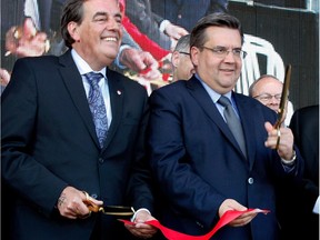 MUHC president and director general Normand Rinfret, left, and Montreal Mayor Denis Coderre smile tafter cutting the official ribbon to inaugurate the new MUHC Glen site in Montreal on Saturday June 20, 2015.