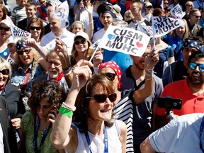 Quebec Immigration Minister Kathleen Weil, centre, waves to the crowd as she takes part in the Walk for Montreal to inaugurate the new MUHC Glen site in Montreal on Saturday June 20, 2015.