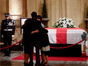 Amélie Duceppe, the daughter of Jean Doré, and her family pay their respects to the former mayor in the Hall of Honour at Montreal city hall on Sunday June 21, 2015. Doré, who served as mayor from 1986 to 1994, died last week from pancreatic cancer.