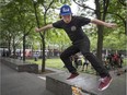 Duylen Kuhn performs a kick flip back tail at Place des Paix during Go Skateboarding Day in Montreal, Sunday, June 21, 2015.