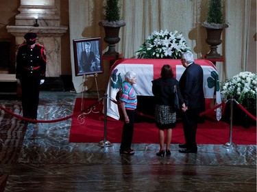 Former executive council member André Lavallée pays his last respects to Jean Doré in the Hall of Honour at Montreal city hall on Sunday June 21, 2015.