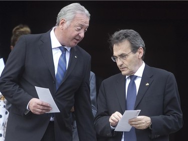 Claude Dauphin, left, with Richard Bergeron following the  funeral services of former Montreal mayor Jean Doré. The service was held at city hall in  Montreal on Monday June 22, 2015.