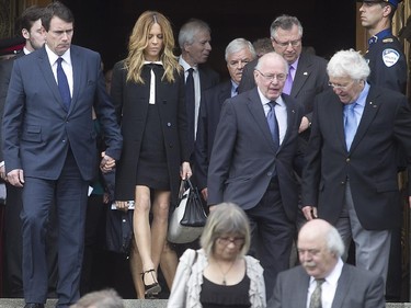 Parti Québécois leader Pierre Karl Péladeau, left, and his partner Julie Snyder, with former Quebec premier Bernard Landry following the funeral services of former Montreal mayor Jean Doré. The service was held at city hall in  Montreal on Monday June 22, 2015.