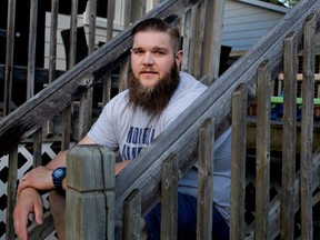 Alouettes offensive-tackle Jeff Perrett sits in the backyard of his home in Montreal on June 24, 2015.
