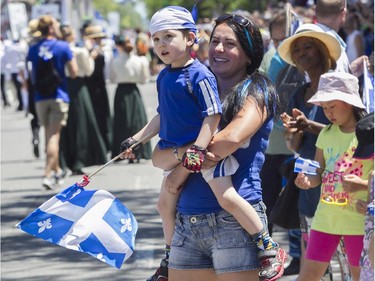 Josée Garceau  and son Gaël enjoy the Fête nationale parade on St. Denis St. Wednesday, June 24, 2015 in Montreal.