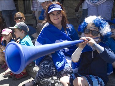 Zachary Parker, with his mom Isabelle, enjoys the Fête nationale parade on St. Denis St. Wednesday, June 24, 2015 in Montreal.