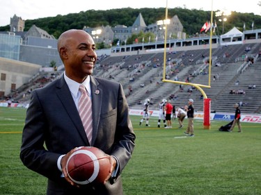 CFL commissioner Jeffrey Orridge visits the Percival Molson Stadium field before the start of the Montreal Alouettes home opener against the Ottawa Redblacks in Montreal on Thursday June 25, 2015.