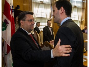 Mayor Denis Coderre, left, met with members of Montreal's and Paris's Jewish communities including Jonathan Arfi, vice-president of the Conseil Representative des Institutions Juives de France (Crif), at city hall in Montreal, on Thursday, June 25, 2015.