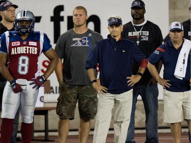 Montreal Alouettes general manager Jim Popp, centre, watches as the clock counts down and the Ottawa Redblacks beat the Alouettes 20-16 during CFL action at the Percival Molson Stadium in Montreal on Thursday June 25, 2015.
