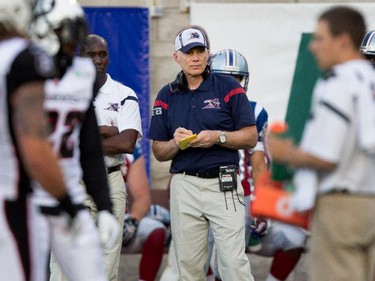Montreal Alouettes head coach Tom Higgins watches on the sidelines at the Percival Molson Stadium in Montreal on Thursday June 25, 2015.
