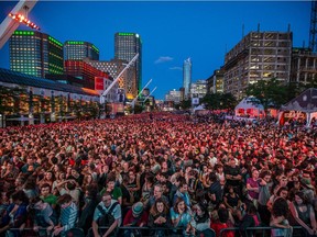 Music fans fill Place des Arts before the performance by the American music group Beirut for the Montreal International Jazz Festival at Place des Arts in Montreal on Friday, June 26, 2015.