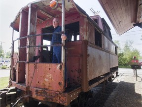 Richard Riley aboard an old caboose he plans to convert into a room for guests to his train-themed bed and breakfast, Riley's Railhouse.