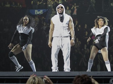 Nelly (centre) and dancers perform during an opening set before the New Kids on the Block show at the Bell Centre in Montreal Tuesday, June 30, 2015.