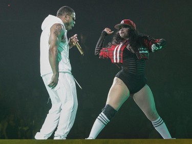 Nelly (left) performs with a dancer during an opening set prior to the New Kids on the Block show at the Bell Centre in Montreal Tuesday, June 30, 2015.