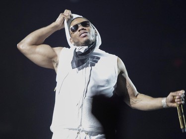Nelly takes his hood down during an opening set before the New Kids on the Block show at the Bell Centre in Montreal Tuesday, June 30, 2015.