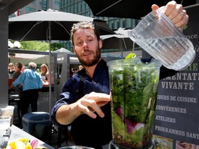 David Côté, CEO of Crudessence, demonstrates how to make a cool green smoothie at the new public market at Place Ville Marie.