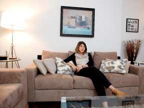 Emily Shore sits in the living room of her home in Montreal.