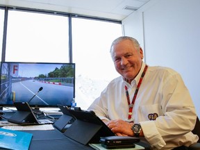 Former Formula One driver Alan Jones poses for a photograph at the control tower of the  Canadian Grand Prix at Circuit Gilles Villeneuve in Montreal on June 5, 2015.