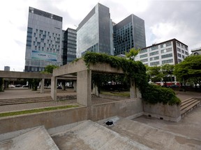 Vines cover sections of Charles Daudelin's Viger Square public art installation, Agora, in Montreal on Friday June 5, 2015. The city has delayed a major facelift of the square which would have seen the concrete structure demolished but preserve Mastodo, a fountain that tips once filled with water. (Allen McInnis / MONTREAL GAZETTE)