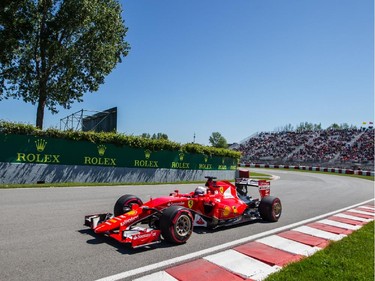 Ferrari Formula 1 driver Sebastian Vettel of Germany exits turn three during the third practice session for the F1 Canadian Grand Prix at Circuit Gilles-Villeneuve in Montreal on Saturday, June 6, 2015.