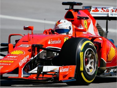 Ferrari Formula 1 driver Sebastian Vettel of Germany takes turn three during the third practice session for the F1 Canadian Grand Prix at Circuit Gilles-Villeneuve in Montreal on Saturday, June 6, 2015.