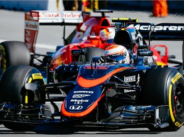 McLaren Formula 1 driver Jenson Button of Great Britain exits turn three during the third practice session for the F1 Canadian Grand Prix at Circuit Gilles-Villeneuve in Montreal on Saturday, June 6, 2015.